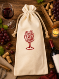 Beautiful canvas wine bottle bag ("But First Wine") with red lettering and a red wine glass graphic—perfect for gifting. Size: 5.9" x 13.7".