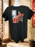 Short-sleeved T-shirt featuring a design of a Geisha dressed in red, sitting in front of a window and holding a small dog in her arms.