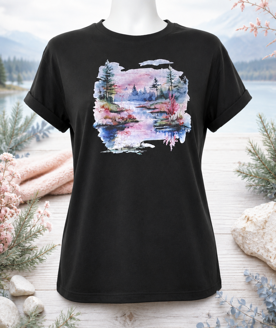 Short-sleeved T-shirt featuring a landscape design with a pinkish-water background and pine trees.