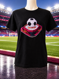 Short-sleeved T-shirt with a soccer ball design on a pink background.