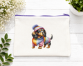 Beautiful zippered canvas case or pencil case featuring a puppy in a multicolored sweater design;